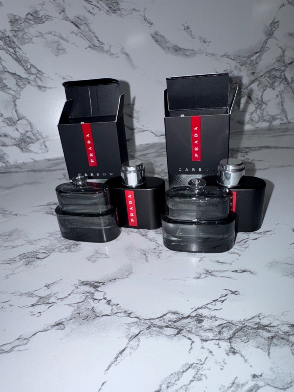 NWT Prada Carbon Luna Rossa 
0.3oz x 2
Never used 
Still in box 
100% authentic
